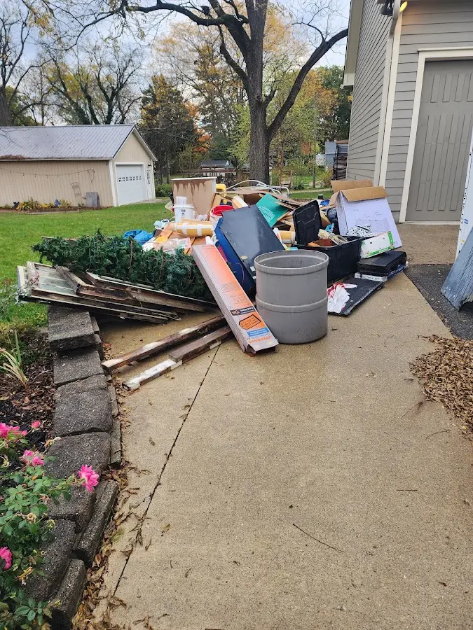 Dumpster being loaded with debris for Residential Dumpster Rental in Offutt AFB